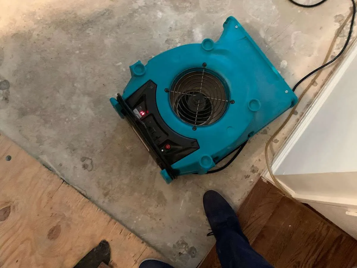 Air mover drying subfloor during Leak Detection & Repair in Steele Creek